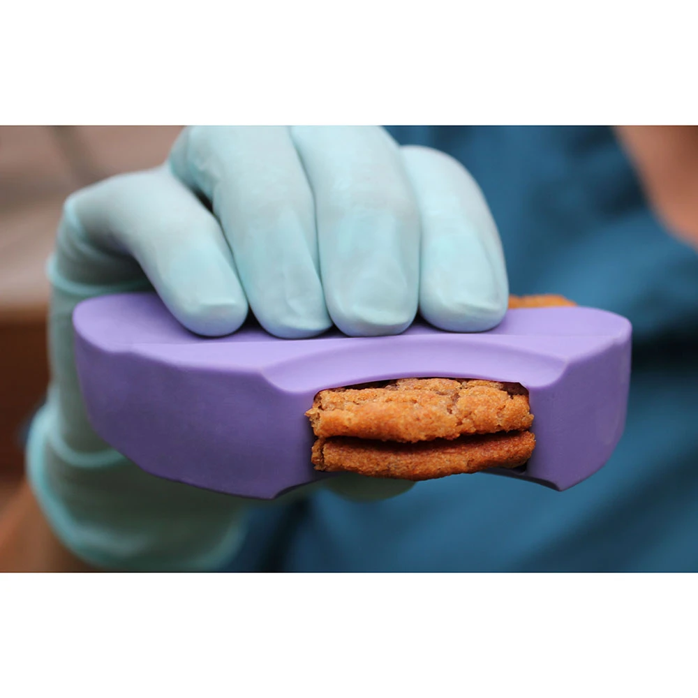 Right bite feeding aid shown with a biscuit to bite into